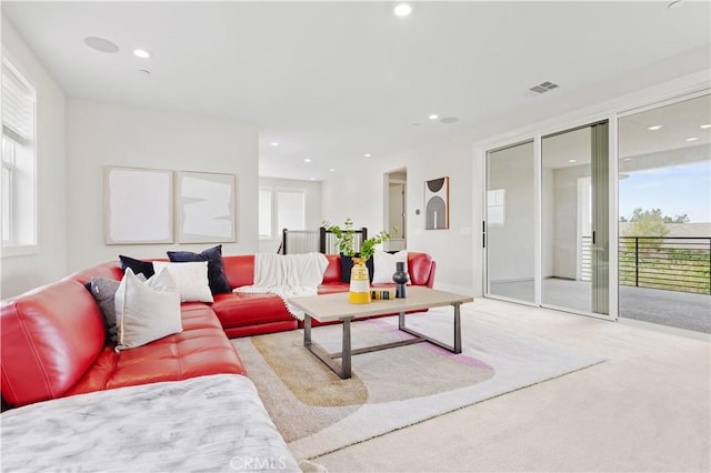 living room featuring recessed lighting and carpet