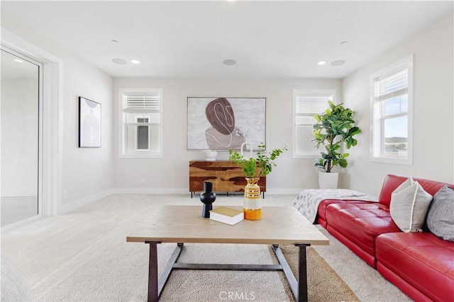 living area with recessed lighting, baseboards, and carpet floors