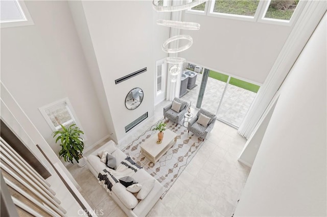 living area featuring a high ceiling