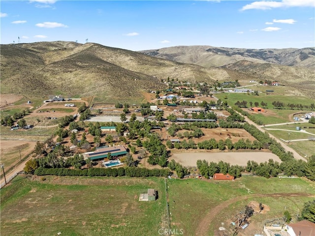 drone / aerial view featuring a mountain view and a rural view