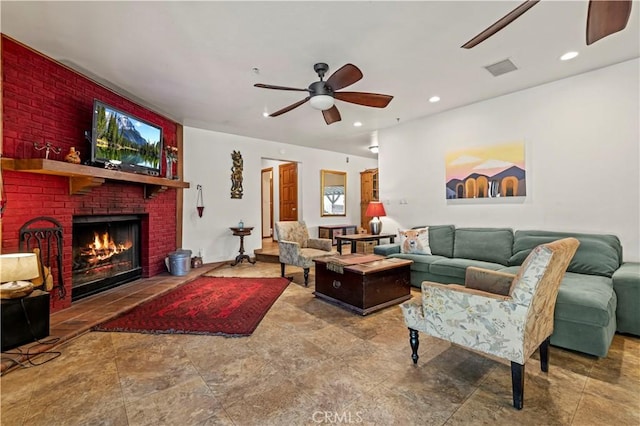 living area with recessed lighting, visible vents, ceiling fan, and a fireplace