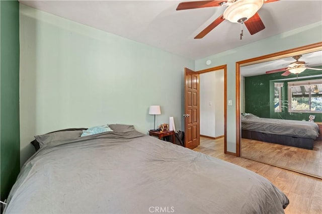 bedroom with wood finished floors and ceiling fan