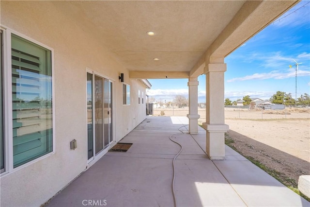 view of patio / terrace featuring fence