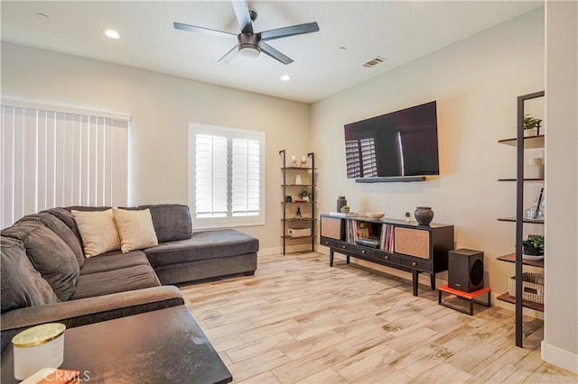 living area featuring light wood-style flooring, recessed lighting, visible vents, and ceiling fan