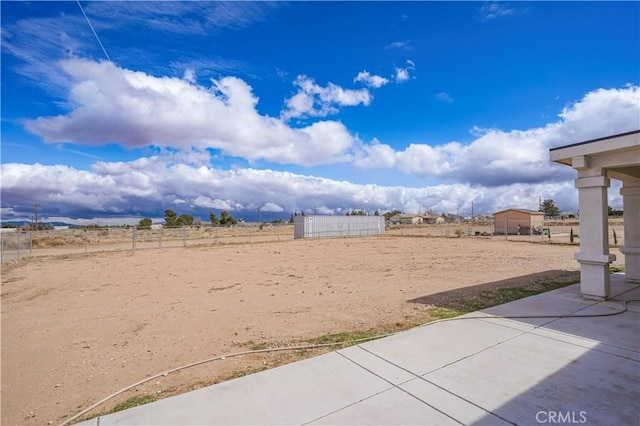 view of yard with a patio and fence