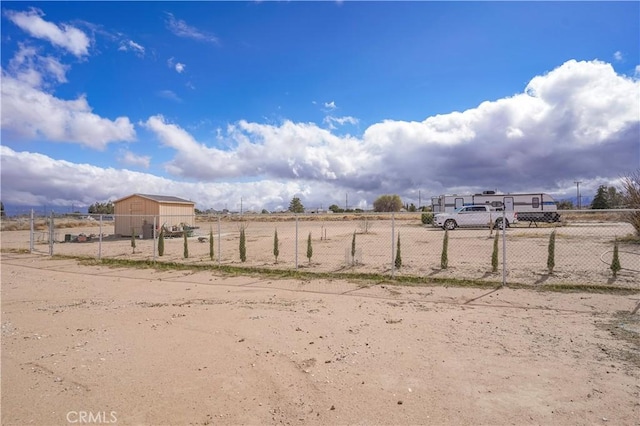 view of yard featuring a rural view and fence