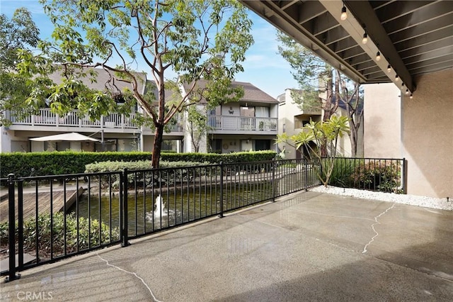 view of patio featuring fence