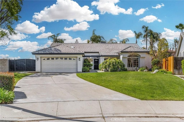 view of front of home with stucco siding, a tiled roof, an attached garage, and fence