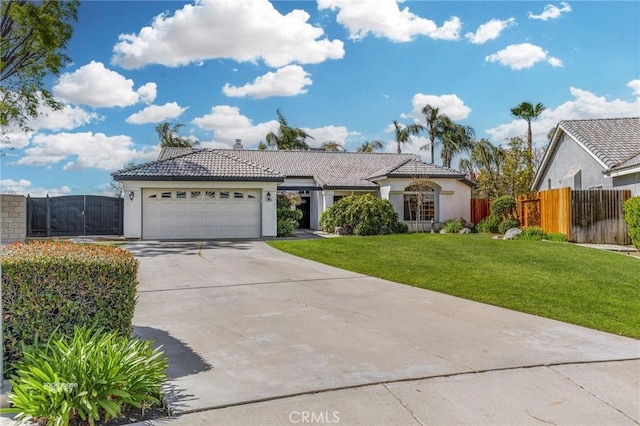 ranch-style home featuring stucco siding, driveway, a front lawn, a tile roof, and an attached garage