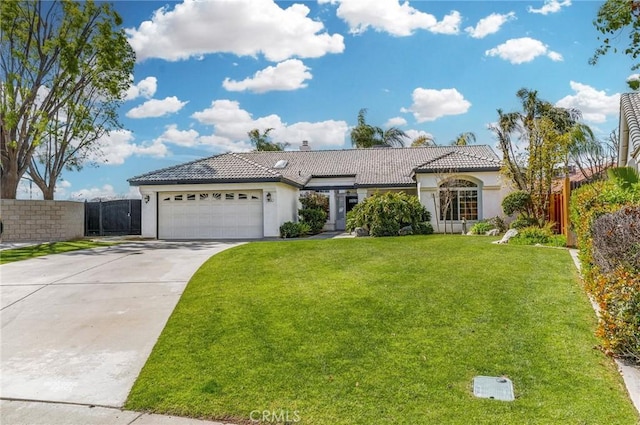 view of front of house with a garage, concrete driveway, stucco siding, and a tile roof