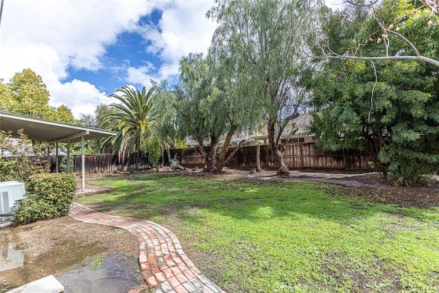 view of yard with cooling unit and a fenced backyard