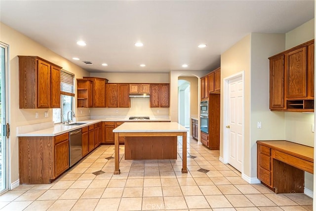 kitchen featuring visible vents, under cabinet range hood, open shelves, appliances with stainless steel finishes, and brown cabinetry