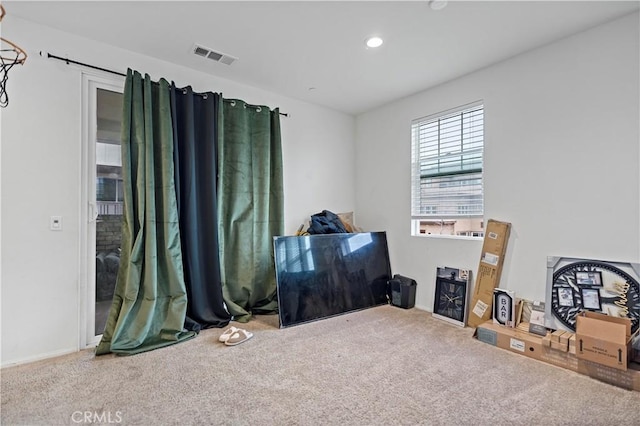 miscellaneous room with visible vents, recessed lighting, and carpet