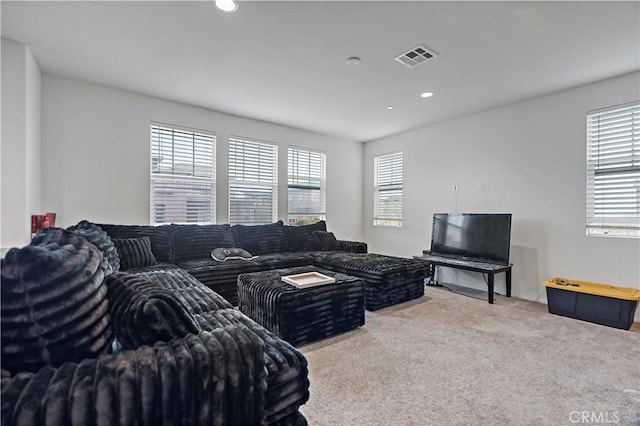 carpeted living room featuring recessed lighting and visible vents