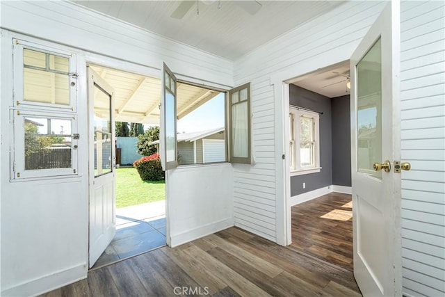 entryway with plenty of natural light, dark wood-type flooring, and ceiling fan