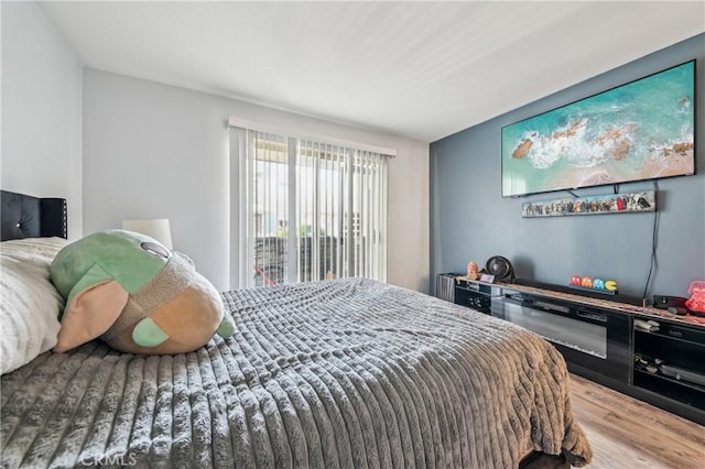 bedroom featuring wood finished floors