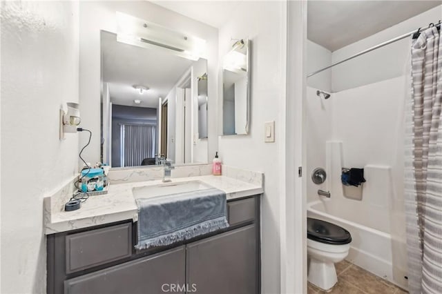 full bathroom featuring tile patterned floors, toilet, vanity, and shower / bath combo