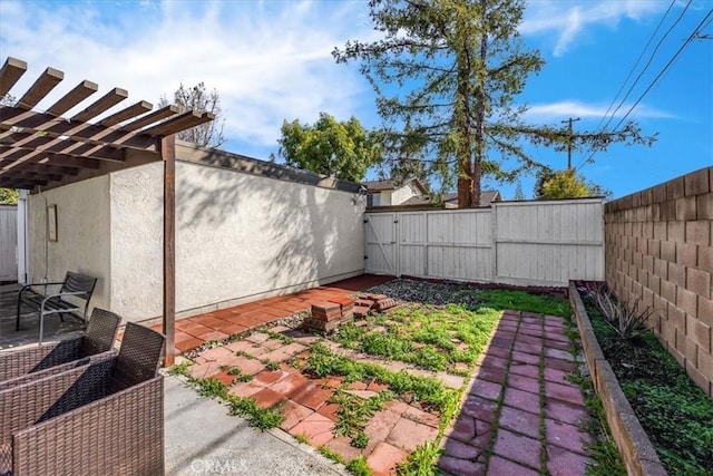 view of yard featuring a patio area and a fenced backyard