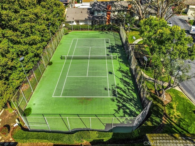 view of sport court with fence