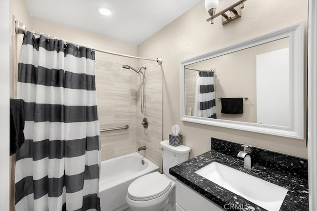 full bath with vanity, toilet, and shower / bath combo