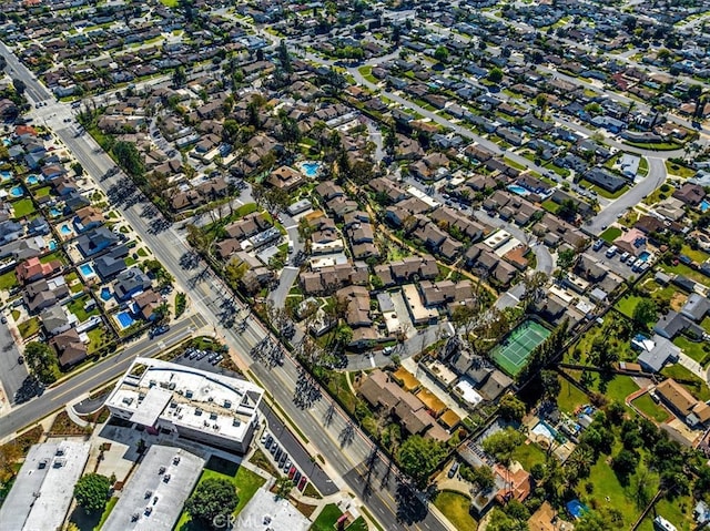 birds eye view of property with a residential view