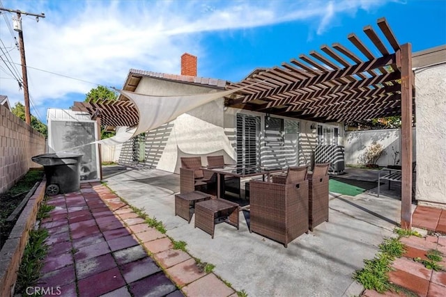 view of patio / terrace with a fenced backyard and a pergola