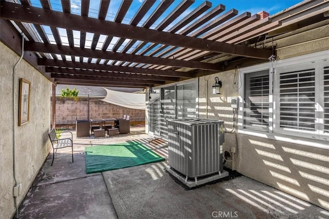 view of patio with fence, central AC, outdoor lounge area, and a pergola