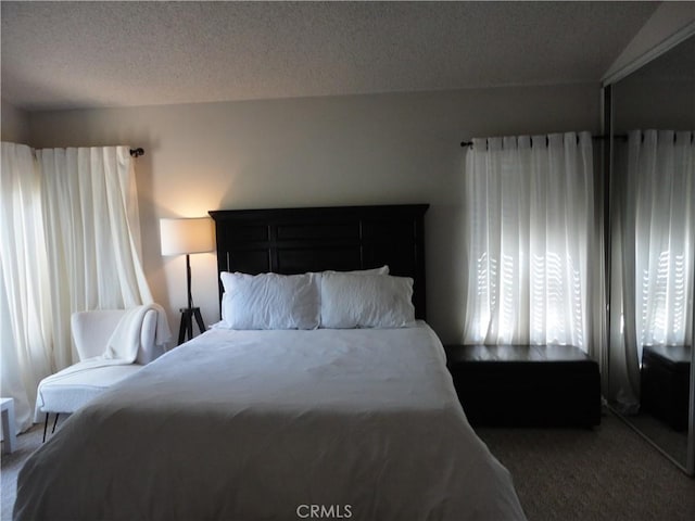 10402 Via Pajaro, Moreno Valley, CA 92557 - bedroom with carpet and a textured ceiling