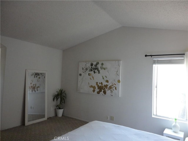 10402 Via Pajaro, Moreno Valley, CA 92557 - carpeted bedroom featuring multiple windows, vaulted ceiling, and a textured ceiling