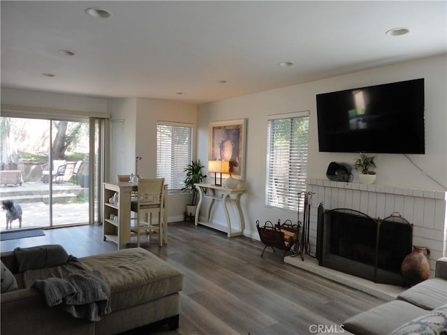 10402 Via Pajaro, Moreno Valley, CA 92557 - living room featuring baseboards, a fireplace, wood finished floors, and recessed lighting