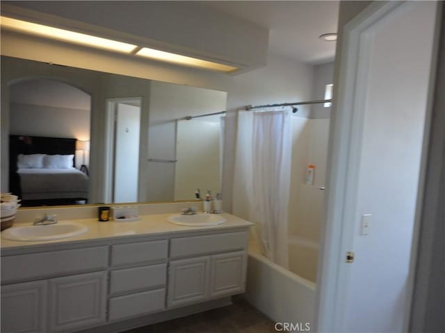 10402 Via Pajaro, Moreno Valley, CA 92557 - full bath with double vanity, a sink, connected bathroom, and shower / bath combo