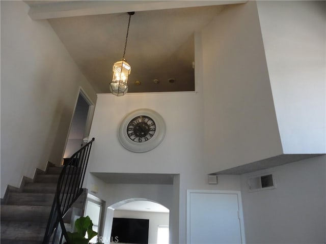 10402 Via Pajaro, Moreno Valley, CA 92557 - stairs with arched walkways, a high ceiling, and visible vents