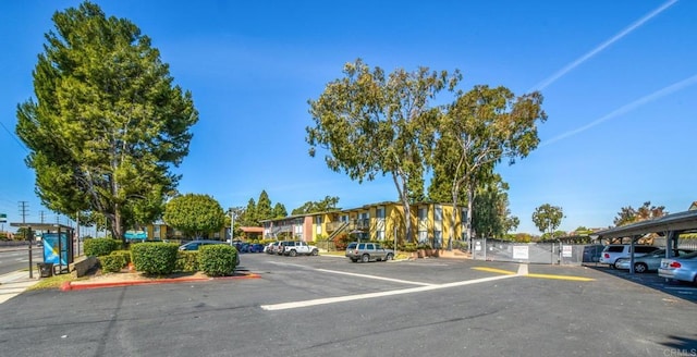 view of car parking with fence