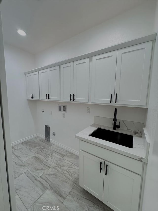 washroom featuring washer hookup, marble finish floor, a sink, cabinet space, and hookup for an electric dryer