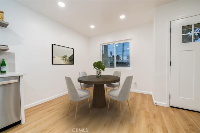 dining room with recessed lighting, light wood-type flooring, and baseboards