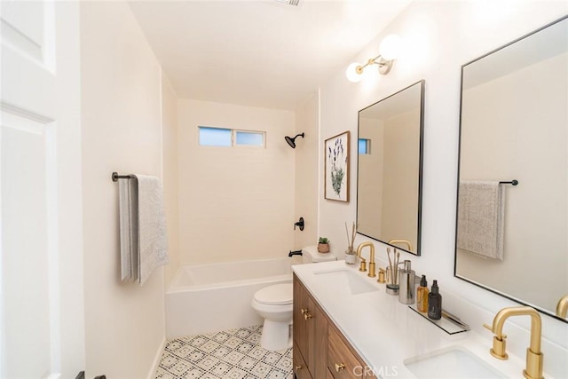 bathroom featuring double vanity, toilet, shower / bathtub combination, and a sink