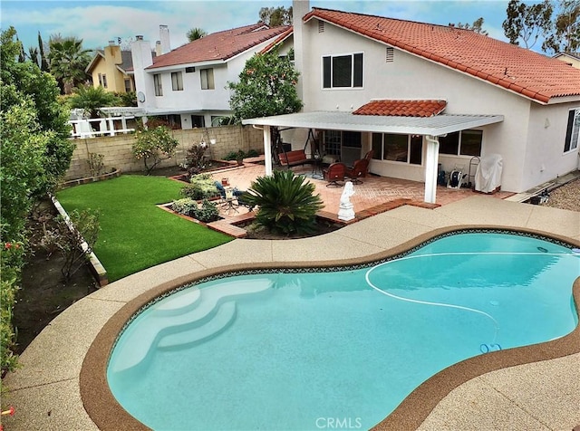 view of pool with a patio, a fenced backyard, a fenced in pool, and a lawn