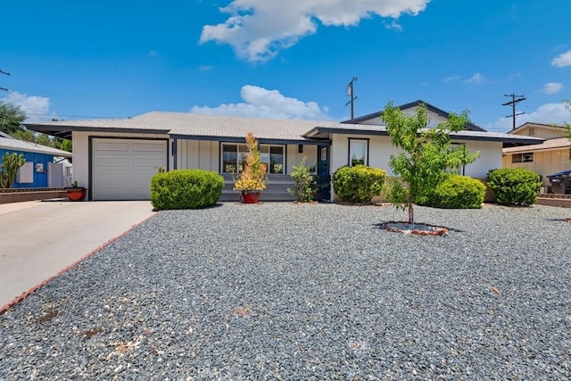 single story home featuring stucco siding, driveway, and an attached garage