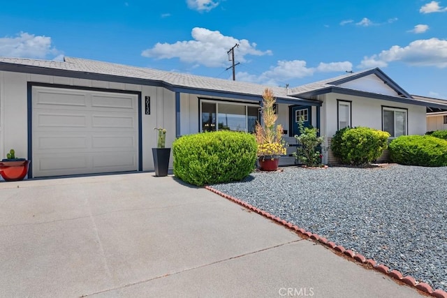 single story home featuring driveway and an attached garage