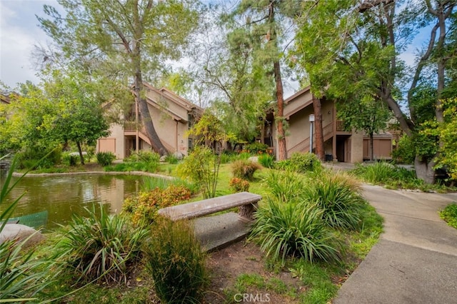 view of home's community featuring stairway