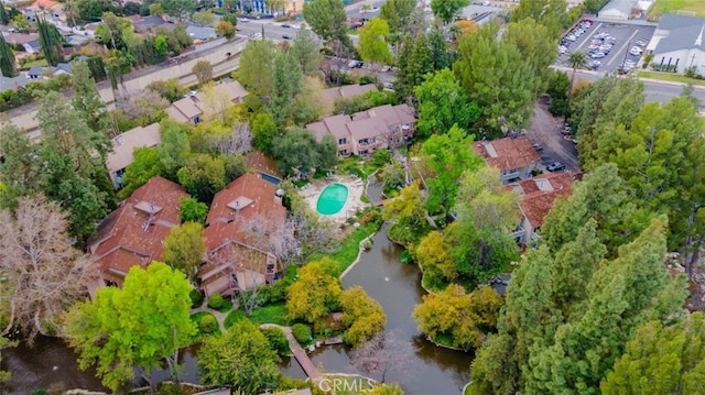 birds eye view of property featuring a residential view and a water view