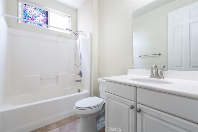 full bathroom featuring vanity, tile patterned floors, toilet, and bathtub / shower combination