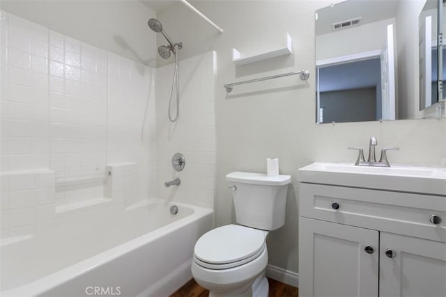 bathroom featuring visible vents, toilet, bathtub / shower combination, and vanity