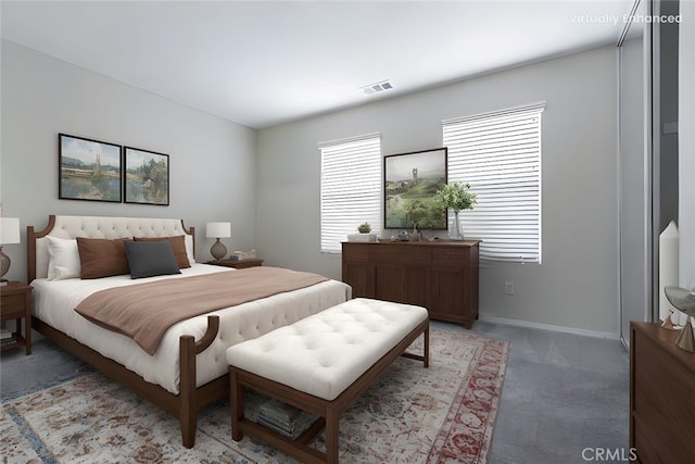 bedroom with visible vents, light carpet, and baseboards