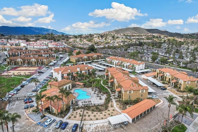 birds eye view of property with a residential view and a mountain view