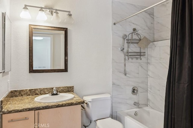 full bathroom featuring toilet, vanity, a textured wall, and shower / bathtub combination with curtain