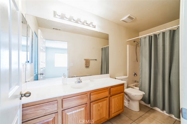 bathroom featuring tile patterned flooring, visible vents, toilet, and vanity