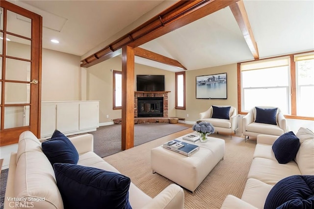 carpeted living room with a glass covered fireplace, vaulted ceiling with beams, recessed lighting, and baseboards