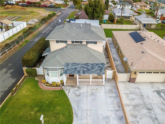 birds eye view of property with a residential view