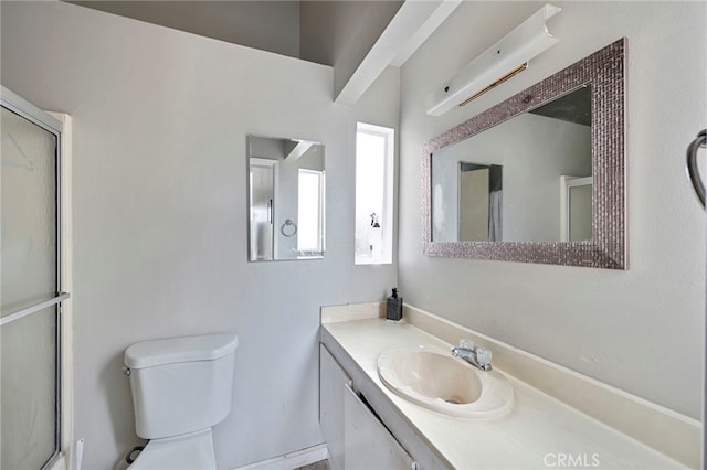 full bathroom with a shower with door, toilet, and vanity